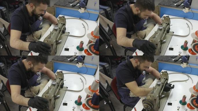 经营小企业的年轻人为机器上的缝纫准备皮带
