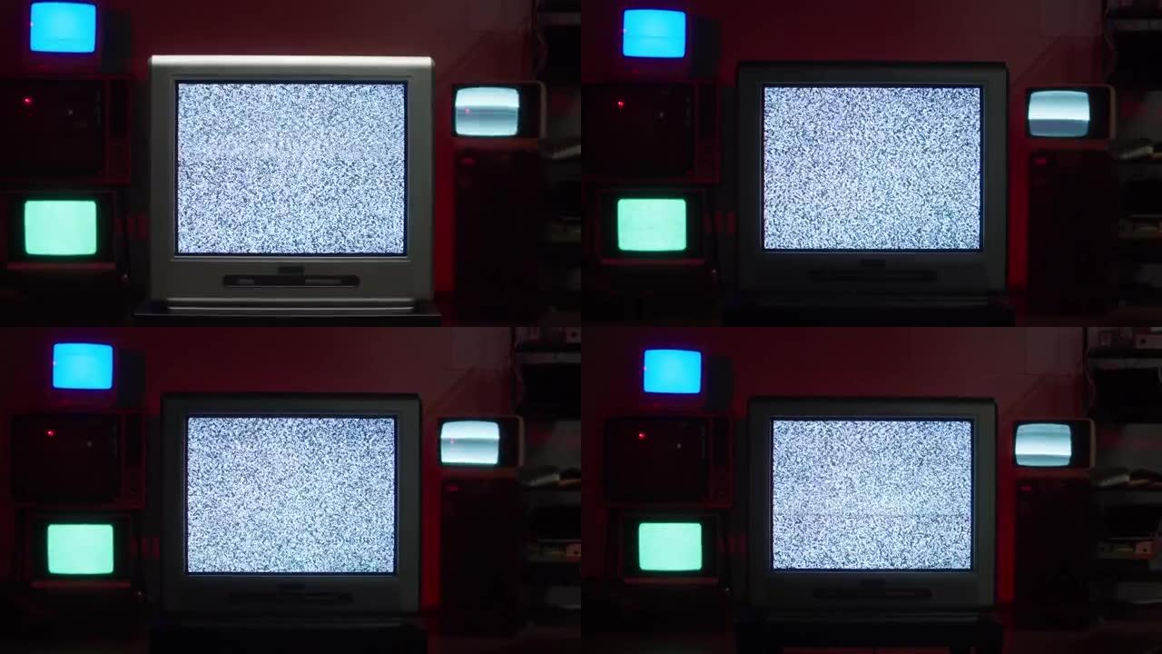 红色霓虹灯背景下的复古旧电视。古老的老式老式电视的组成，带有灰屏，信号接收不良，波纹和干扰，摄影概念