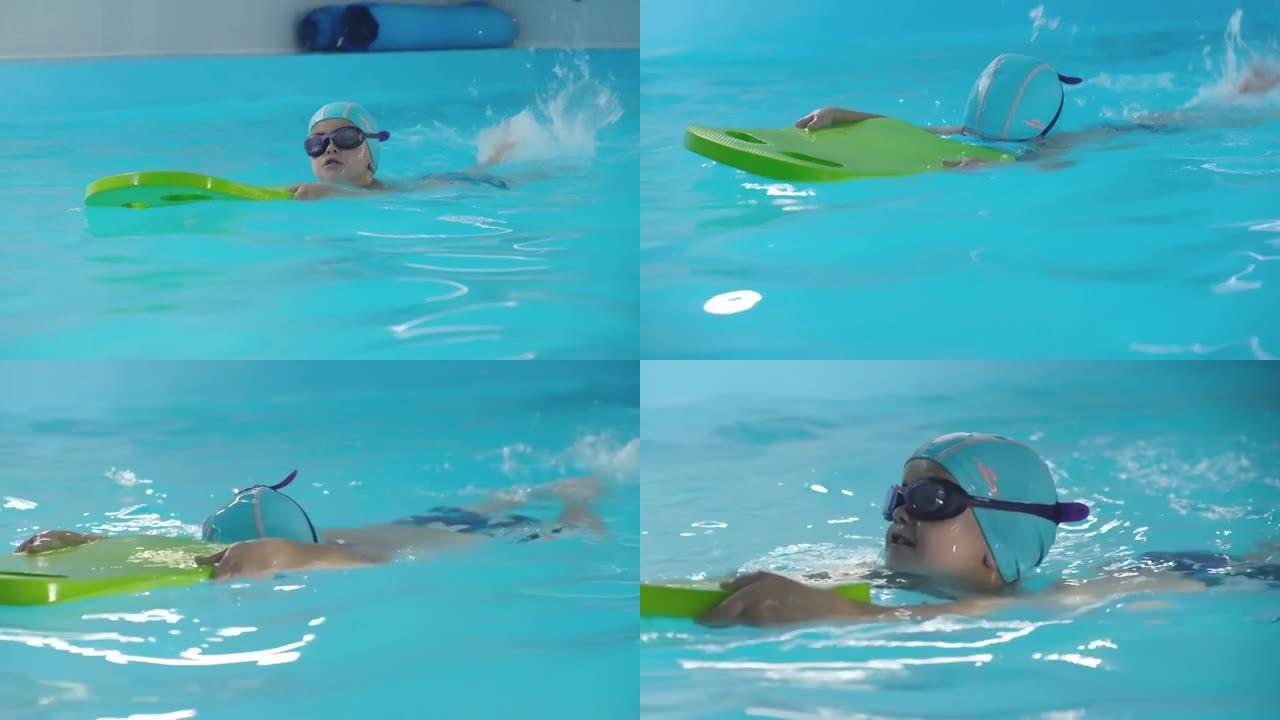 2021-09俄罗斯，克拉斯诺达尔，小男孩正在教练的游泳池里训练。慢动作