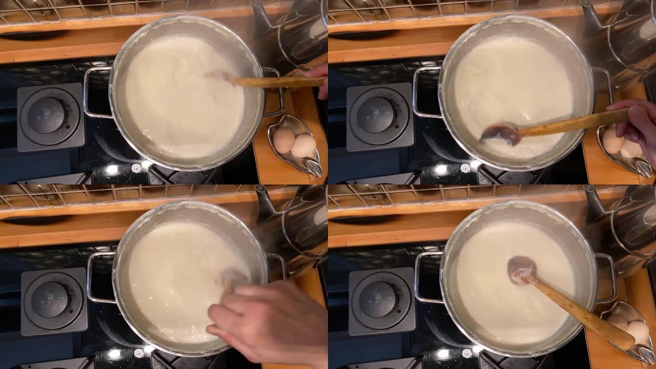 用木勺锅煮牛奶视频