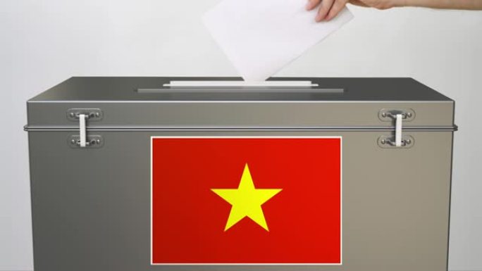 将纸选票放入印有越南国旗的投票箱。投票的相关视频