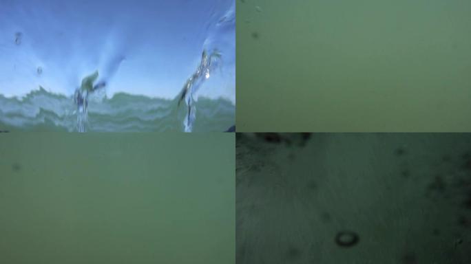 摄像机淹没了，在水下。在水中融化时统治的概念。很多气泡。