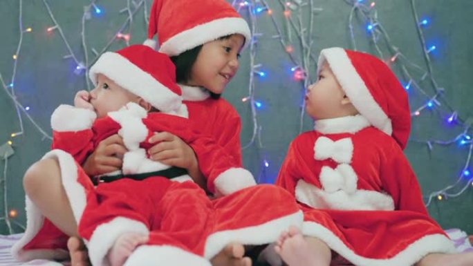 圣诞节在家中穿着圣诞服装的亚洲婴儿肖像。