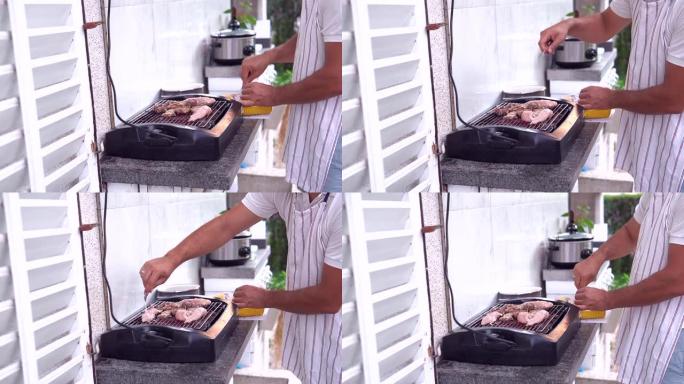 男子在后院烧烤肉的特写照片