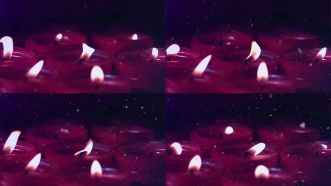积雪落在点燃的红色蜡烛上的动画