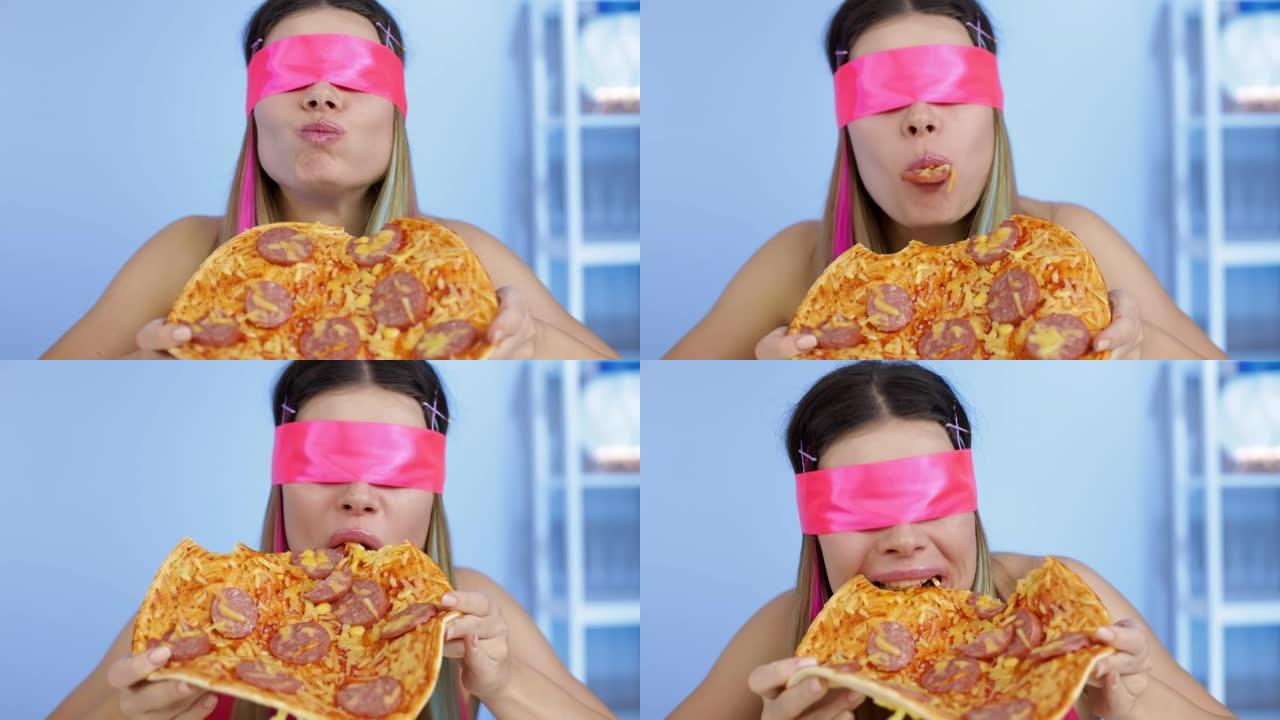 饥饿的女孩蒙着眼睛吃意大利辣香肠披萨