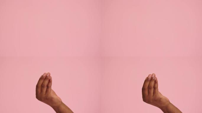 非裔美国人手四指手势孤立在粉红色背景