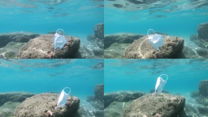 二手外科口罩漂浮在海洋生态系统上，covid19环境污染