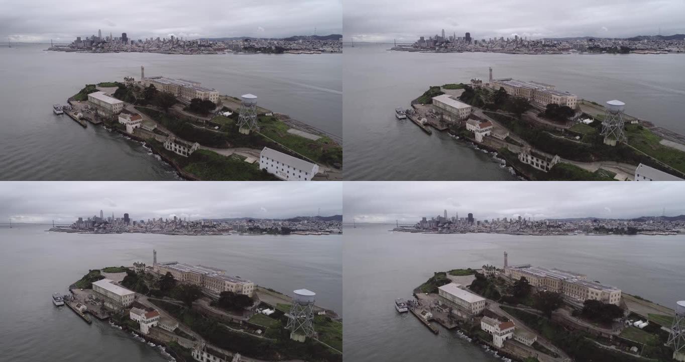旧金山湾恶魔岛的鸟瞰图。美国。最著名的恶魔岛监狱，监狱。观光的地方。背景中的旧金山城市景观。多云的天