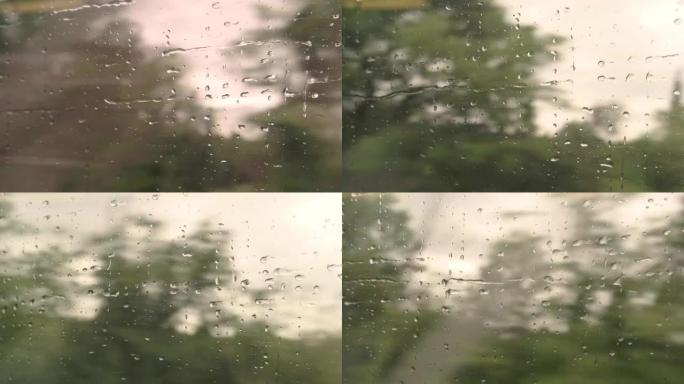 火车车窗上移动的水滴。