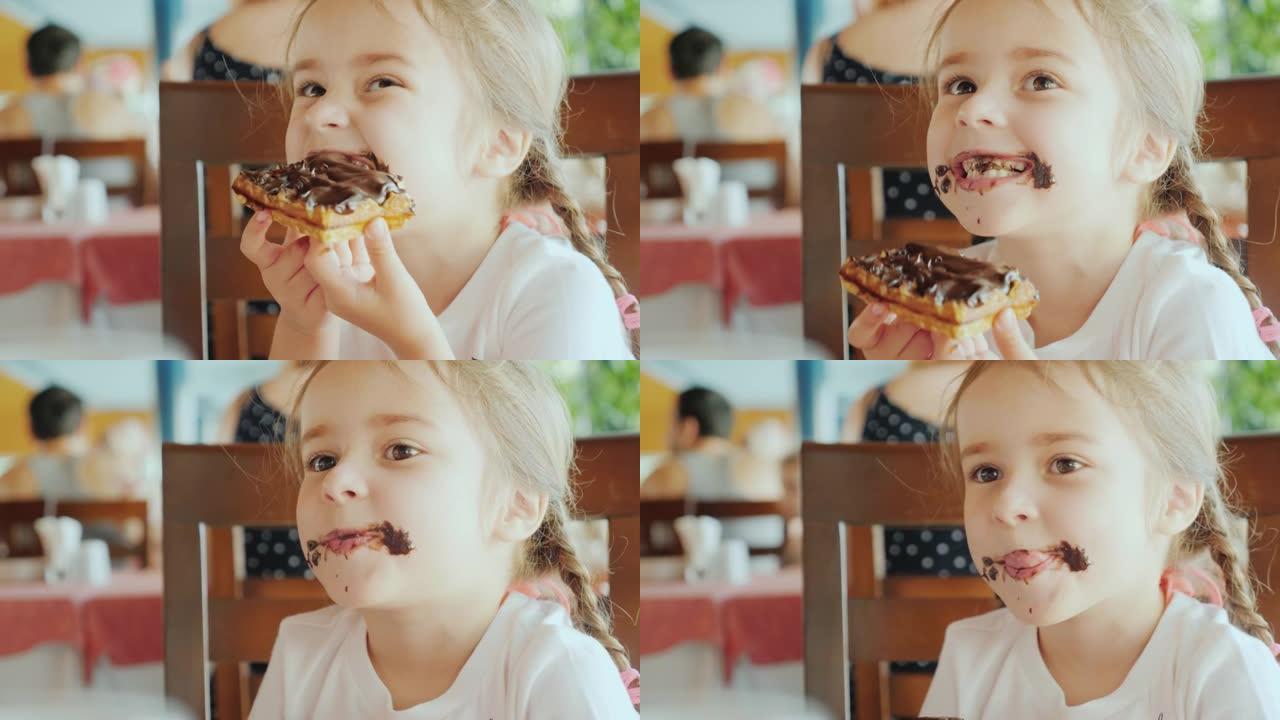 小甜心被巧克力弄脏了，孩子坐在餐馆里吃巧克力蛋糕
