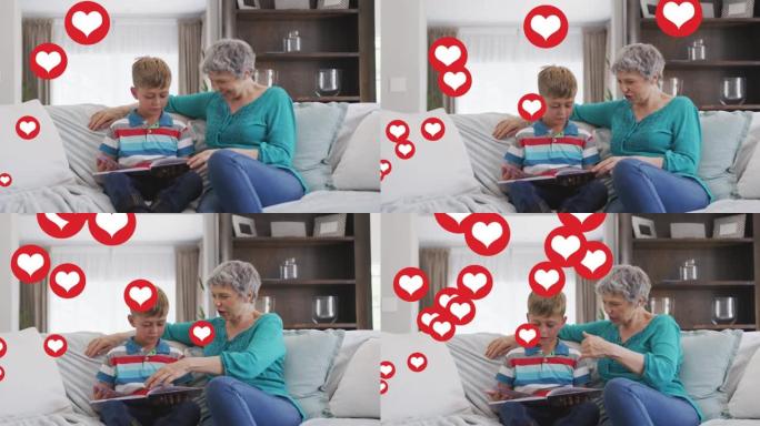 在livin groom的高加索祖母和孙子阅读书上的心脏图标动画