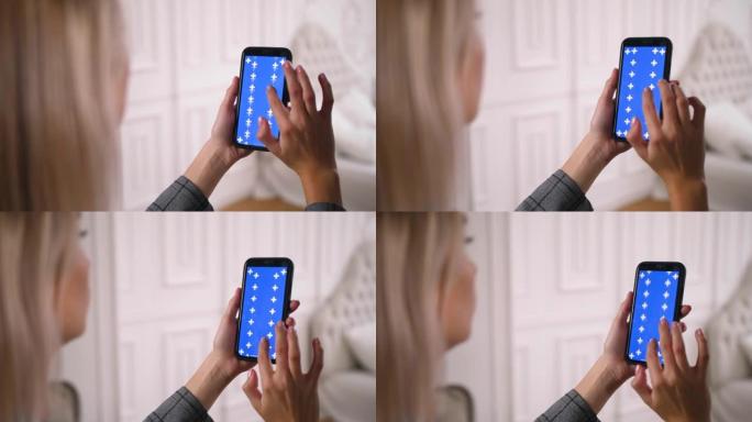 蓝色色度键智能手机屏幕滑动，用手指上下滚动。