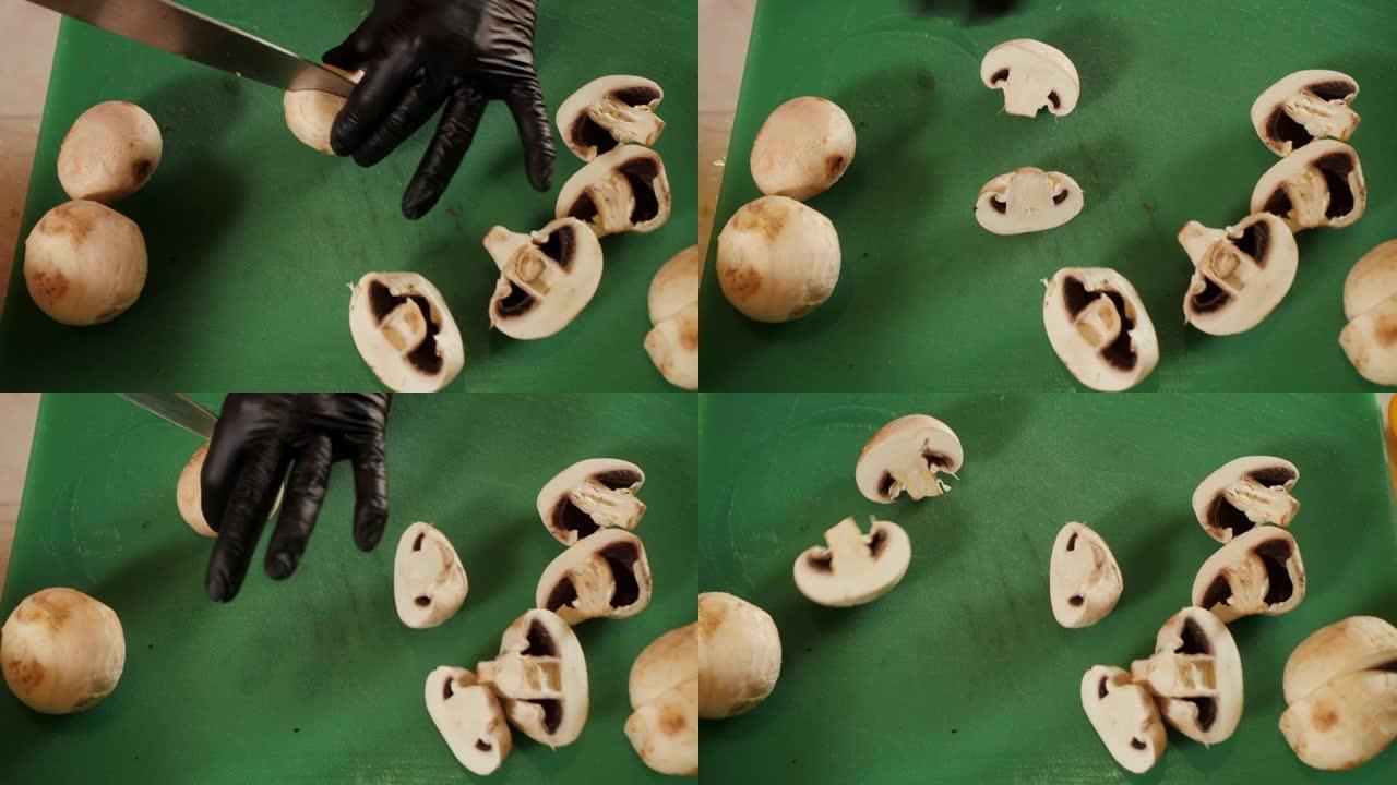 厨师用刀切割新鲜香菇的特写视图