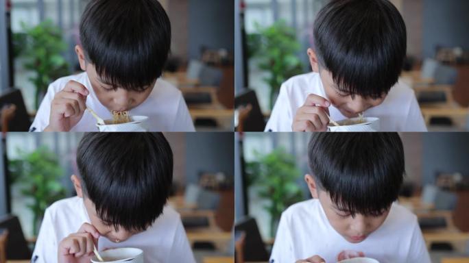 亚洲男孩喜欢吃面条杯