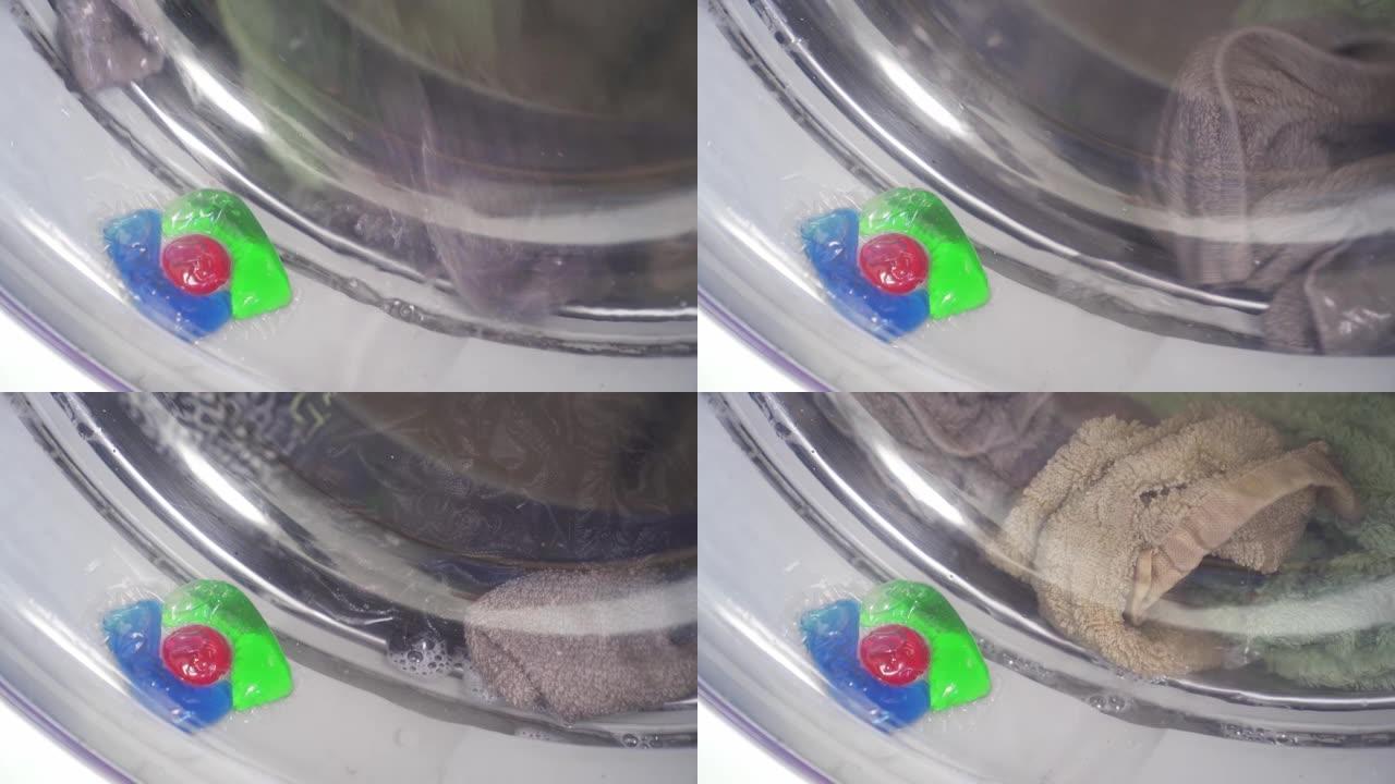 装有洗衣粉的胶囊卡在洗衣机的门上。