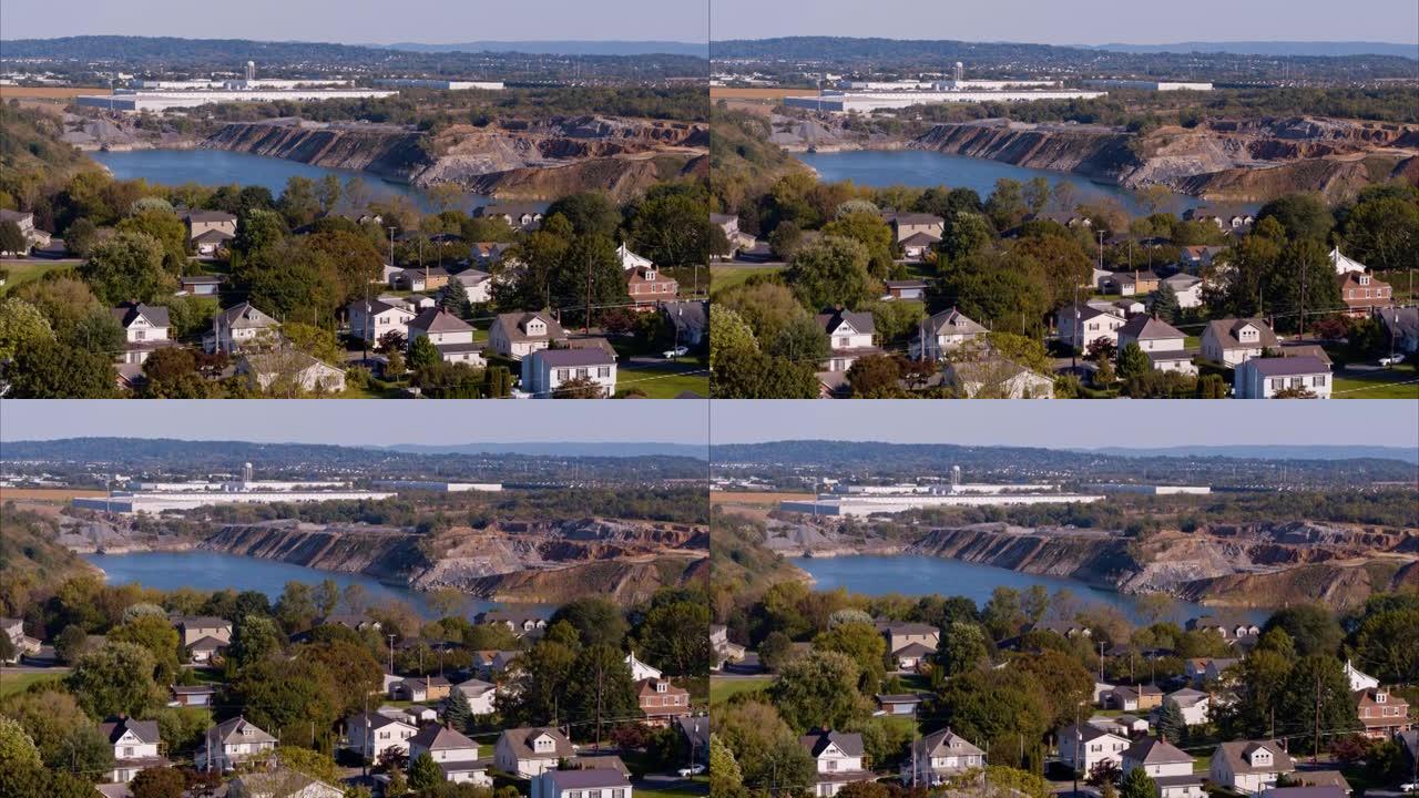 湖是在宾夕法尼亚州拿撒勒附近被水淹没的旧露天采石场中形成的。带有转发摄像机运动的航空视频。