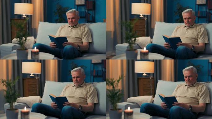 一个成熟的男人在茶几上的客厅沙发上用蜡烛放松。一个年长的男人心满意足地在沙发上看书。学长在嘲笑这部小