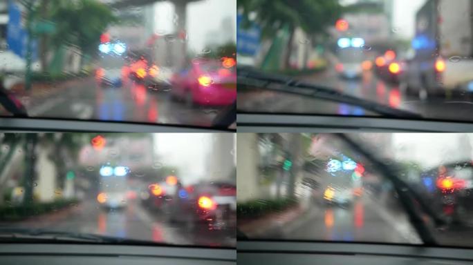 城市雨水中的交通，驾驶汽车，道路上的暴风雨，高速公路，挡风玻璃上的雨滴