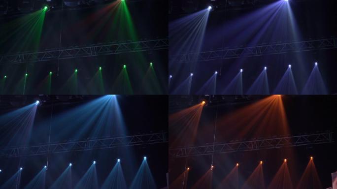舞台灯光框架的动画。明亮闪亮的舞台灯闪烁运动娱乐聚光灯投影仪在黑暗中，绿色柔和的灯光聚光灯撞击在黑色