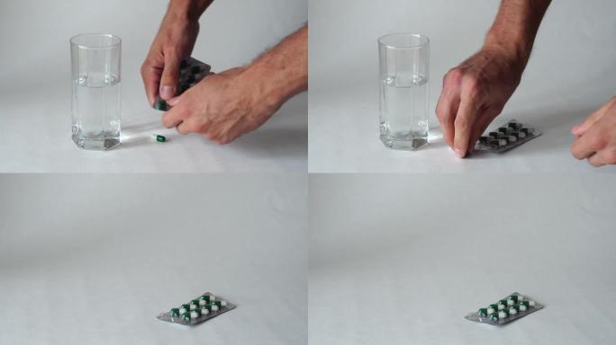 散布在白色表面上的不同颜色的药片。医药产品