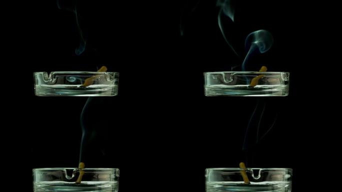 雪茄在复制空间的黑色背景下在烟灰缸中闷烧。香烟烟雾。