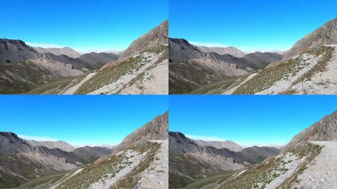从行驶中的全地形车，在一条土路上，在意大利阿尔卑斯山的cole de Sommellier上录制的视