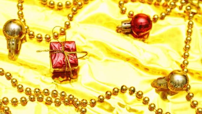 礼品盒，闪亮的金色和红色迪斯科球，闪闪发光