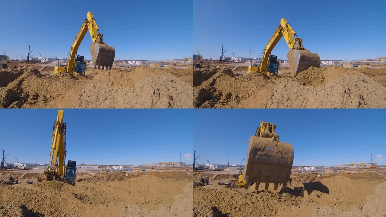 在建筑上的土方工程，挖掘机铲平了大片的沙子