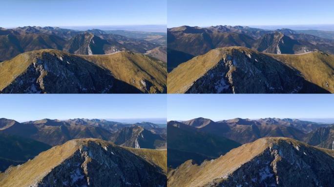 在Ciemniak的圆形山峰上飞行，秋天可以欣赏塔特拉山脉的深远景色。4k镜头