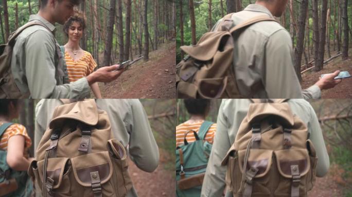 年轻的徒步旅行者在智能手机上使用GPS地图在树林中导航