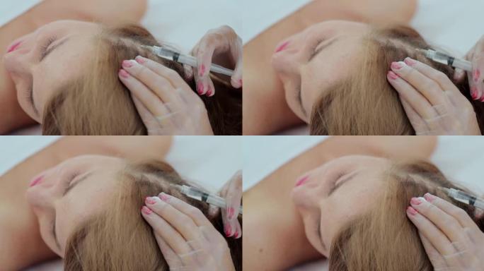 美发美发疗法用于美容院的头发生长和强化。医生给头皮注射头发生长。