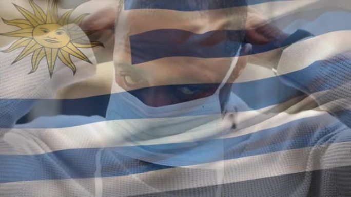 在covid 19大流行期间，乌拉圭国旗挥舞着戴着口罩的男子的动画
