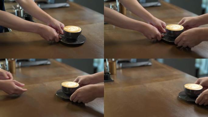 4k亚洲男子咖啡师在柜台上向顾客提供热咖啡和牛奶