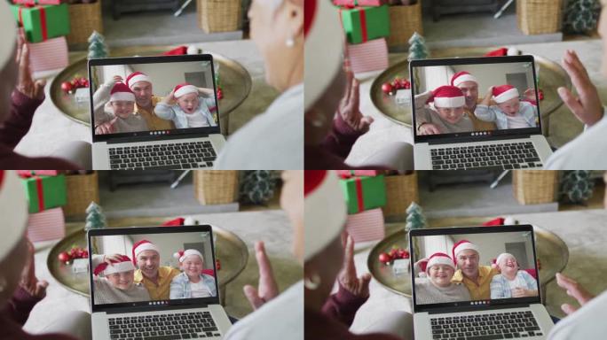 两个不同的资深女性朋友使用笔记本电脑与家人在屏幕上进行圣诞节视频通话