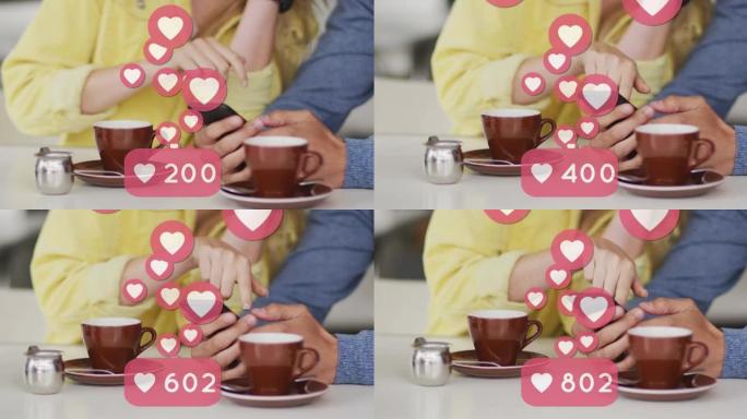 使用智能手机和喝咖啡的高加索夫妇漂浮的心脏图标动画