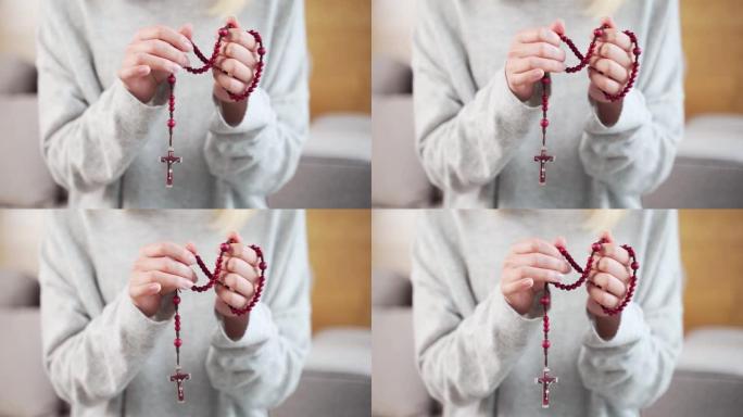基督教念珠与近距离女性。女人的手在教堂、寺庙或家里祈祷