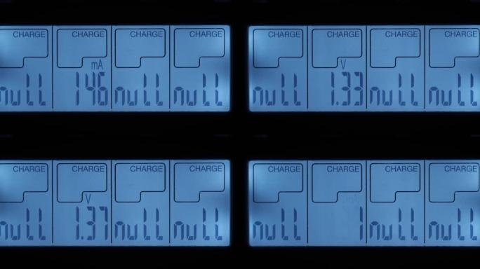 特写。充电器显示器。蓄能器充电。显示的充电符号。显示充电电池的电流、伏特和容量的参数