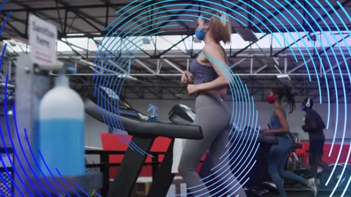 在跑步机器上运动的口罩上，蓝色螺旋在女性身上旋转的动画