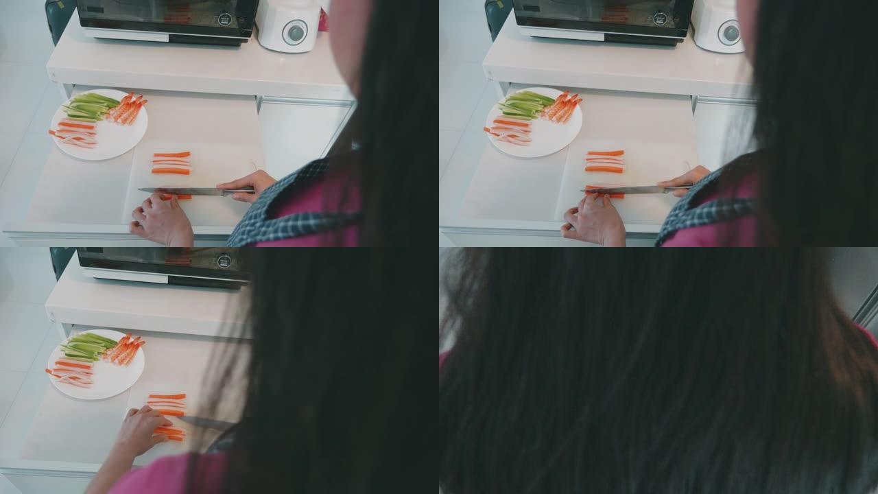 女人在家做寿司卷的特写镜头。