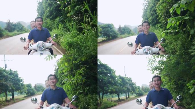 亚洲祖父母享受退休生活，在当地街头骑白色踏板车，无心关爱积极的老年人骑摩托车，充满正能量，再次感到年