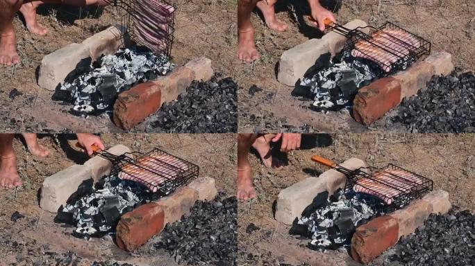 野餐时，男人薯条传统烤肉串。特写。