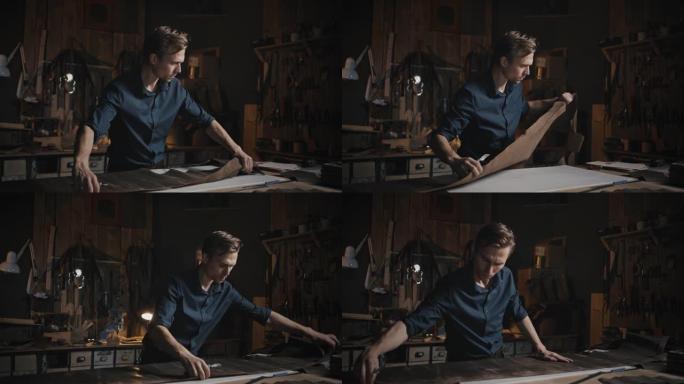 工艺爱好。年轻人在创意车间使用皮革面料，制作服装产品，慢动作