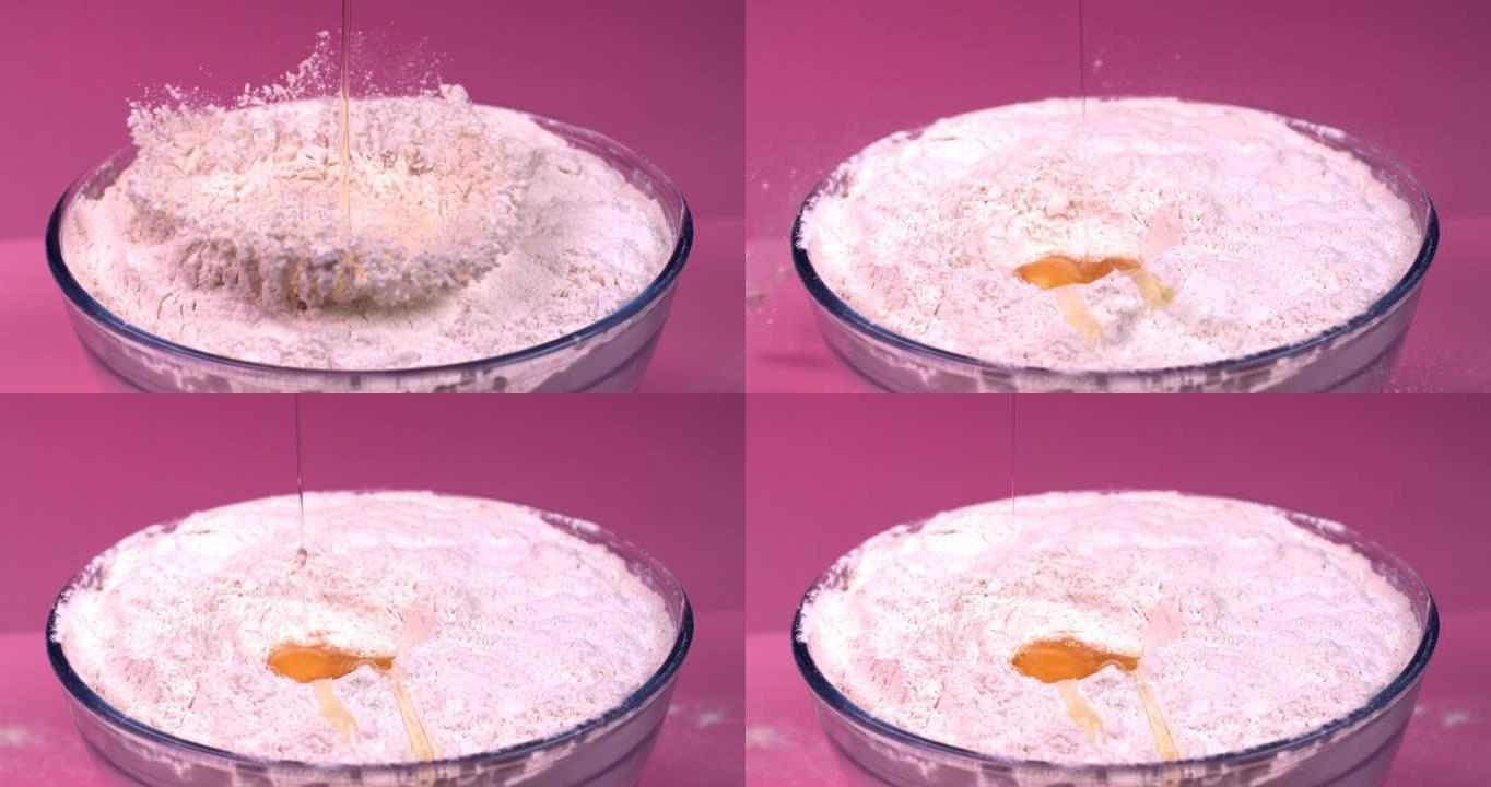 鸡蛋以慢动作落入一碗面粉中
