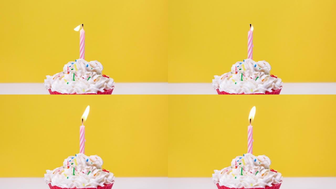 近距离观看美味的奶油蛋糕和一根燃烧的蛋糕蜡烛，孤立在黄色背景上。吹出一根蛋糕蜡烛。全高清慢动作生日快