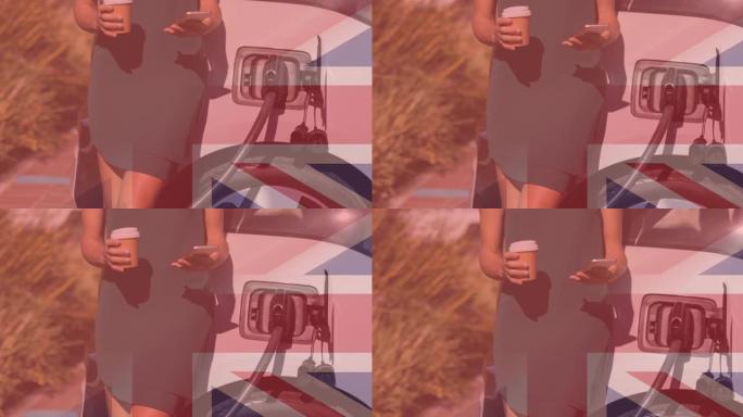 英国国旗对使用智能手机和电动汽车充电的妇女
