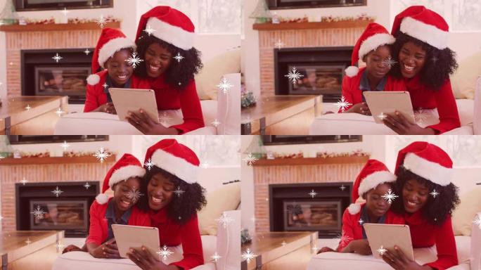 圣诞节用平板电脑降落在非裔美国母亲与儿子的积雪动画