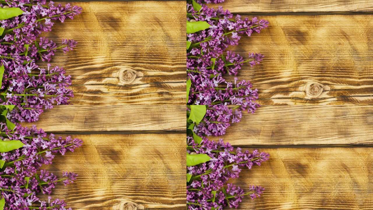 一束淡紫色的花朵躺在古老的木制背景上