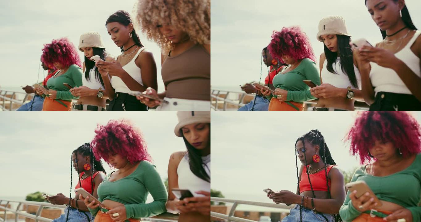 一群女性朋友站在外面使用手机的4k视频片段