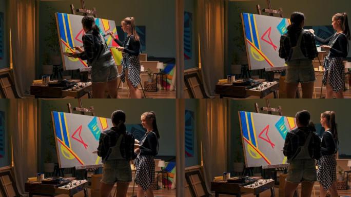 艺术家的朋友在绘画工作室里度过时光，使用专业画笔在画布上创作一幅画，女人建议颜色，他们讨论，交谈，赞